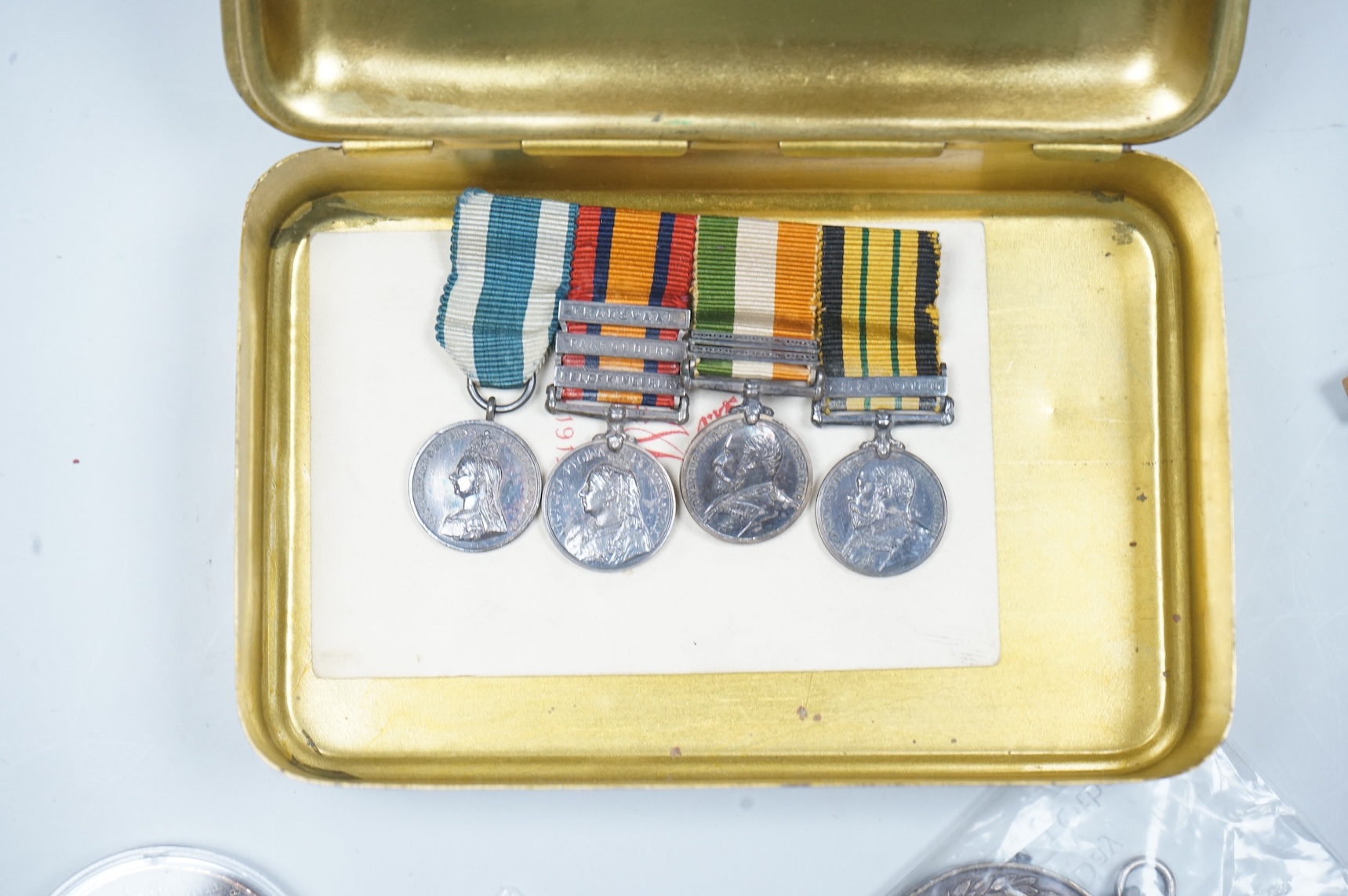 A QSA medal group miniature, comprising miniatures of; the Queen Victoria Golden Jubilee medal, the Queen’s South Africa medal with three clasps, the King’s South Africa medal with two clasps and the Africa General Servi